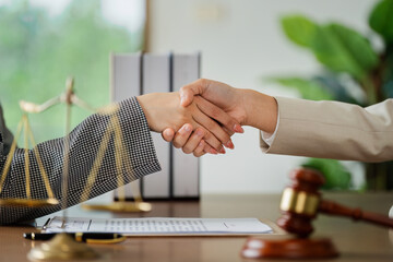 Lawyer handshake with a client making about documents, contracts, agreements, cooperation agreement