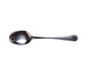 Stainless steel soup spoon on transparent background