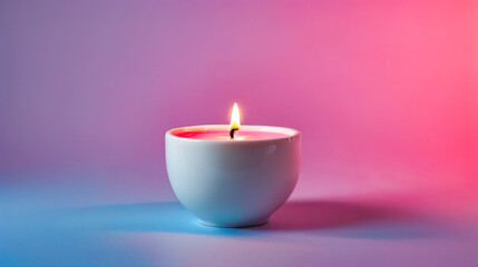 Obraz na płótnie Canvas Lit candle inside white cup that is sitting on purple background.