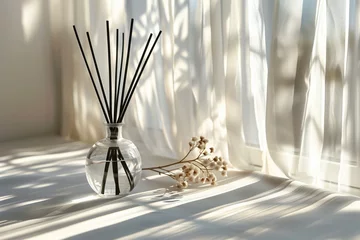 Poster A glass diffuser bottle with black rattan sticks, minimalism, concept quiet luxury. Sunlight from window. Concept aromatherapy and relaxing. Air freshener. Copy space for text.  © Anastasiia