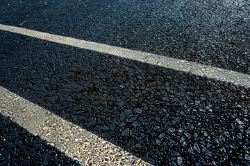 Fototapeta premium illustration of dark wet asphalt texture. Created with Generative AI