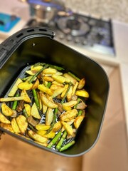 vegetables from the air fryer, vegetables baked in the fryer, baked potatoes, french fries, green asparagus, sliced oyster mushrooms, vegetables baked in hot air