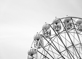 Ferris wheel. A part of a ferris wheel. Black and white and minimalist photography. 