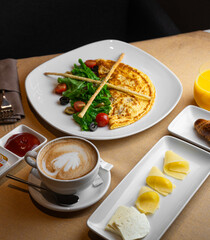Breakfast omelette with aromatic cappuccino