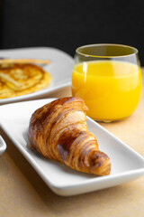 Breakfast with croissant and orange juice