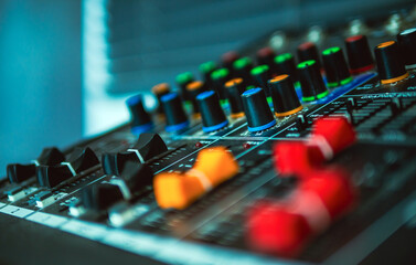 Close-up of sound recording equipment knobs.Mixer control. Music engineer. Backstage controls on an...