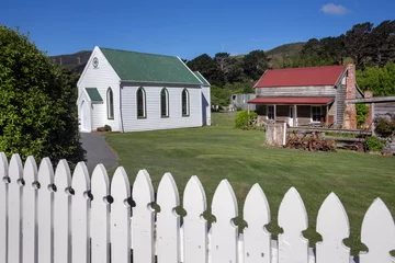 Fototapeten Historic white wooden church at Makara Wellington New Zealand. White wooden fence.  © A
