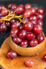 large red wet grapes in drops of water