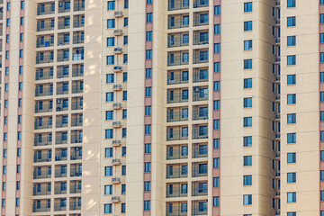 The appearance of urban residential buildings with regular window close-up