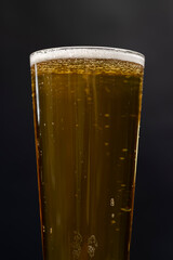 a glass glass with an alcoholic drink in close-up