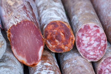 Appetizing acorn-fed Iberian pork loin sausage, Iberian salchichon and Iberian chorizo for sale in street markets in Extremadura.