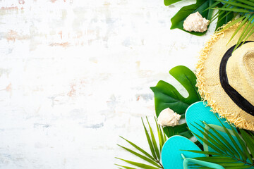 Summer flat lay background, vacation and travel concept. Palm leaves, hat, flip flop and sunglasses...