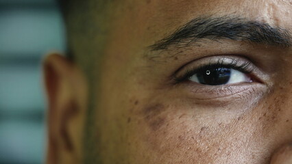Detail macro close-up of a hispanic black man closing eye in meditation. serene peaceful...