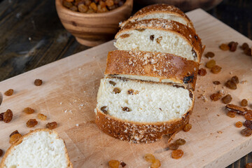 sweet bun with golden raisins, closeup