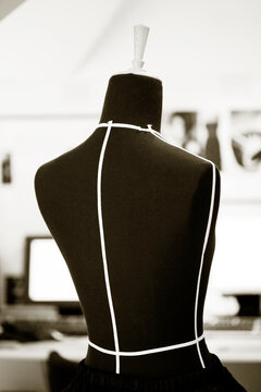 A mannequin awaits its fashion destiny in a design studio