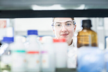 Focused researcher analyzing samples in a laboratory setting