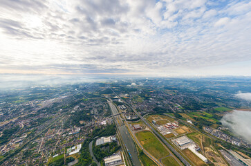 Fototapeta na wymiar Ghent, Belgium. Industrial area. Panorama of the city. Summer day, cloudy weather. Aerial view