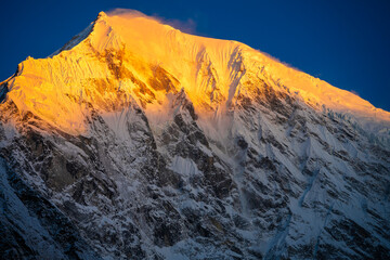 Sunrise Glow on Langtang Lirung's Snowy Summit, Nepal