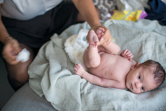Tender moment during baby's diaper change