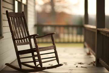 Fototapeten Verandazeit: Idyllisch-romantisches Bild eines Schaukelstuhls auf der Veranda © Seegraphie