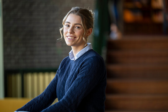 Smiling woman in a cozy caf environment