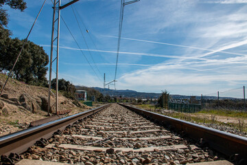 Fototapeta na wymiar Train tracks where you can see all the details of the railway, cables, towers, rails...