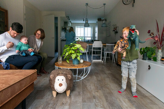 Family enjoying a cozy moment in their warm, inviting living room.