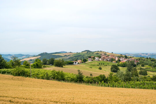 Rolling hills with a rural village and farmland