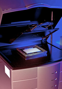 Sleek modern scanner illuminated in blue