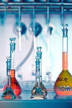 Colorful chemistry glassware arranged on a lab bench