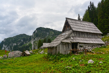 A traditional wooden chalet in the heart of the Julian Alps in Slovenia above Lake Bohinj in the...