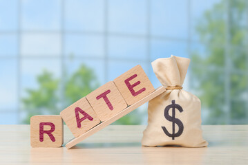 Interest Rate Concept with Wooden Blocks and money bag with dollar sign - 757242386