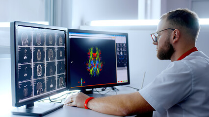 Medical hospital: neurologist use computer, analyze patient's MRI, diagnose brain. Health Clinic Lab: A professional doctor examines a functioning CT scan - obrazy, fototapety, plakaty