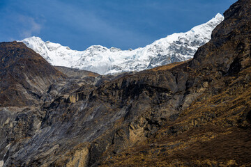 Contrast of Rugged Cliffs and Snow-Capped Summits, Trek from Mundu to Lama Hotel, Langtang, Nepal