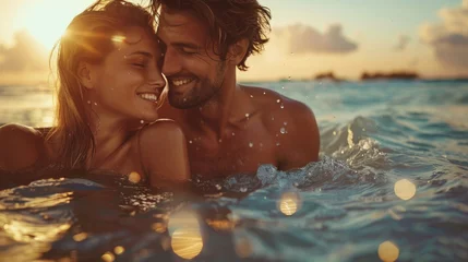 Zelfklevend Fotobehang Affectionate couple bathing in the sea at sunset © Jose