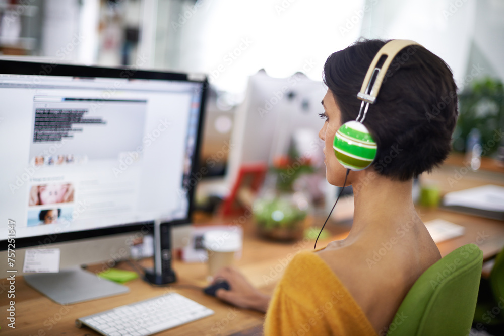 Poster business, designer and woman with headphones at computer screen in office for creative internship an