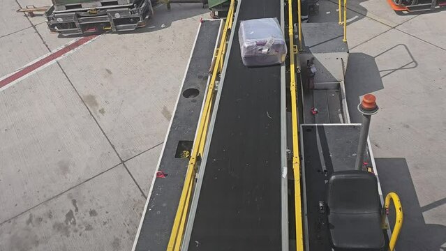 Passengers luggage is loaded onto the plane. Baggage rules and flights for tourists