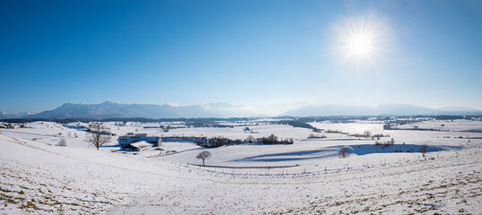 view to bavarian alps over snowy landscape near Aidling, Blaues Land upper bavaria
