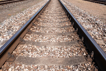 Closeup of empty straight railroad track. Perspective view.