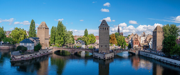 Panoramic view on The Ponts Couverts in Strasbourg with blue cloudy sky. France. - 757258583