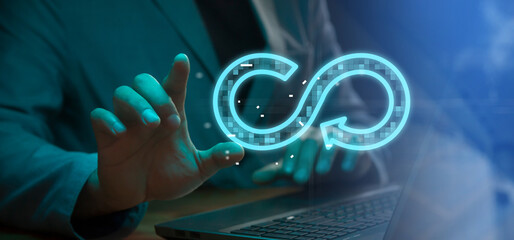 Cg tech collage. Against the background of a silhouette of an employee with a laptop, there is an infinity symbol