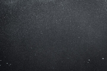 Dark gray textured surface. Free space for text. Concrete background.