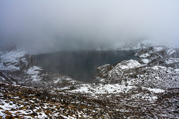 Misty Veil over the Sacred Gosainkunda Lake in the High Himalayas of Nepal