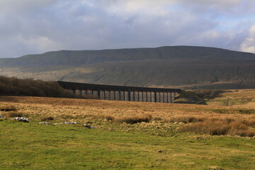Ribblehead Viaduct under the brooding mass of Wernside, Yorkshires highest peak.