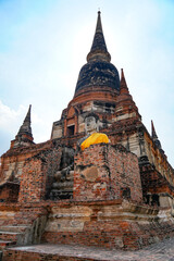 Fototapeta premium Buddha statue and pagoda of Wat Yai Chai Mongkol Ayutthaya Province, Thailand, taken on 23-02-2024.