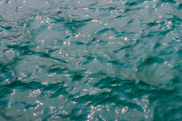 Emerald green sea texture background Glittering reflected in the sunlight Look and feel refreshed.