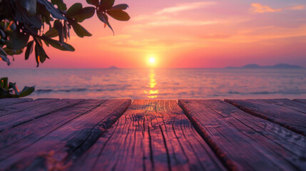 A breathtaking sunset view from a weathered wooden pier extending over a tranquil ocean.