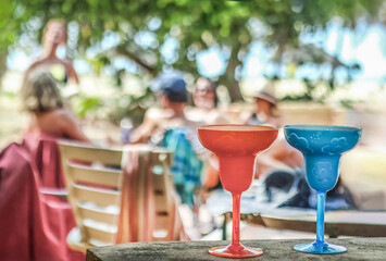 Coastal Cheers: Group of Friends Enjoying Cocktails beachside