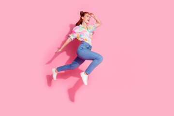 Full body size photo of red hair charming woman young age jump running touch forehead far away looking isolated on pink color background