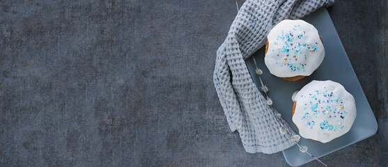 Happy easter card. Delicious Easter cakes on dark textured background